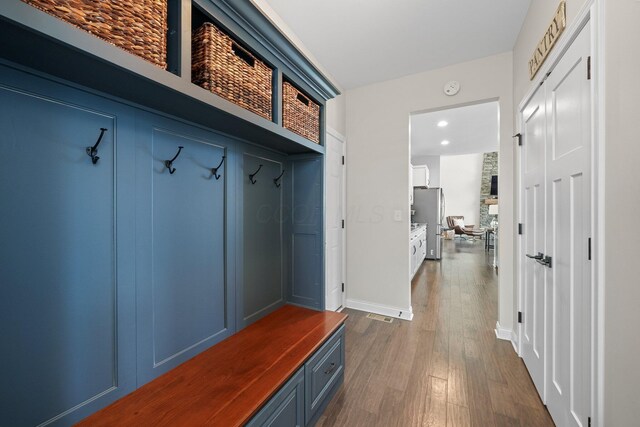 8153 Lilium Way, Plain City, OH 43064 - mudroom featuring recessed lighting, visible vents, baseboards, and dark wood-type flooring