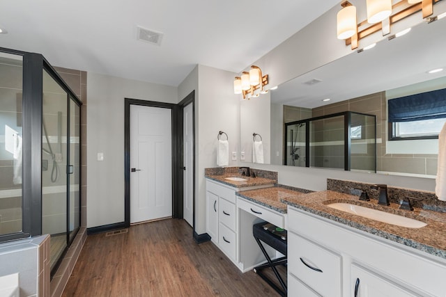 8153 Lilium Way, Plain City, OH 43064 - full bath featuring visible vents, a stall shower, wood finished floors, and a sink