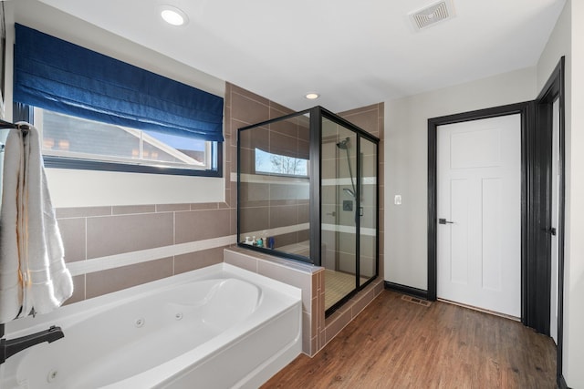 8153 Lilium Way, Plain City, OH 43064 - bathroom featuring recessed lighting, a whirlpool tub, a stall shower, visible vents, and wood finished floors