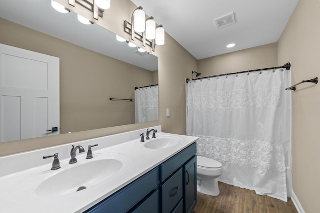 8153 Lilium Way, Plain City, OH 43064 - bathroom featuring toilet, a sink, wood finished floors, and visible vents