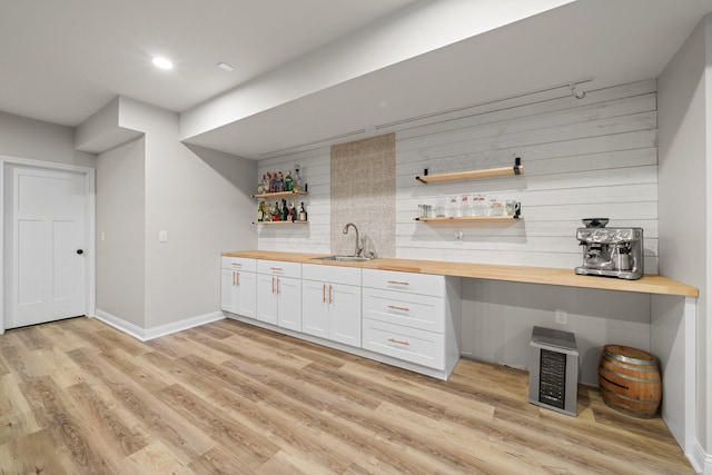 8153 Lilium Way, Plain City, OH 43064 - bar featuring light wood-type flooring, recessed lighting, indoor wet bar, and a sink