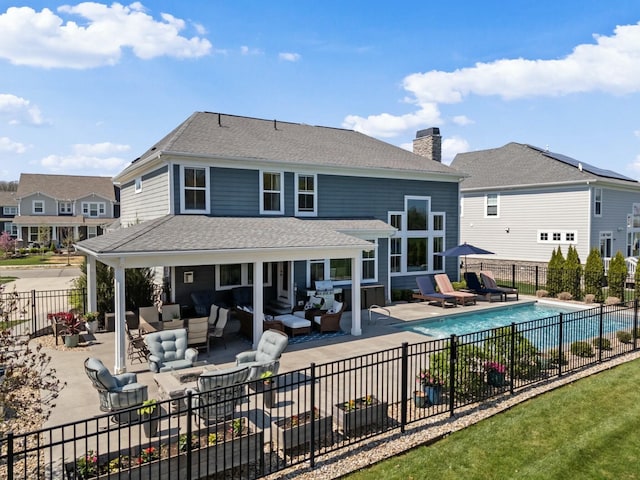 8153 Lilium Way, Plain City, OH 43064 - back of house featuring outdoor lounge area, fence, a chimney, and a patio area