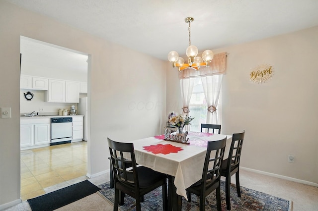dining area featuring a notable chandelier and baseboards