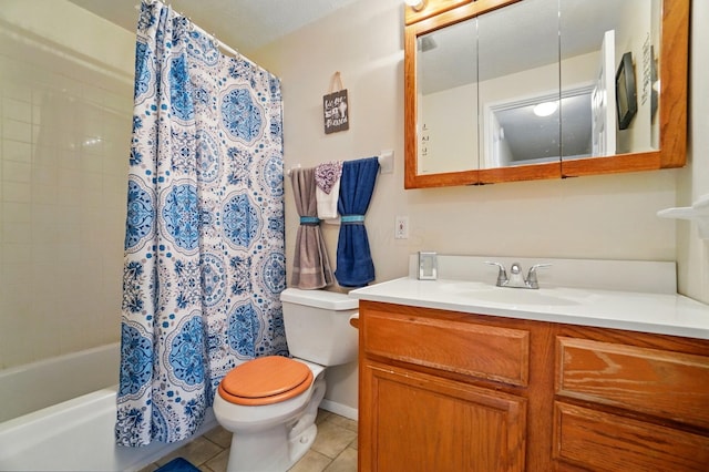 bathroom featuring shower / bath combo with shower curtain, vanity, toilet, and tile patterned flooring