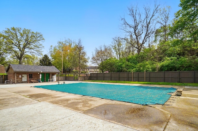 view of swimming pool featuring a patio, fence, and a fenced in pool