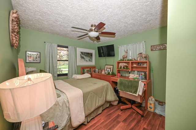 bedroom featuring a textured ceiling, ceiling fan, and wood finished floors