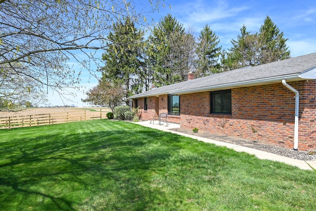 view of yard with fence and a patio area