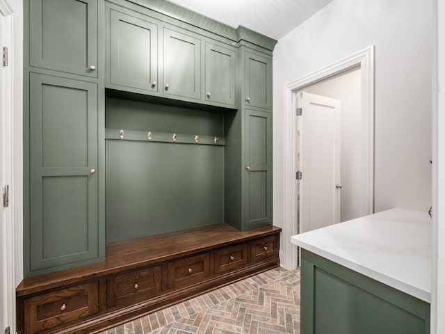 mudroom with brick patterned flooring