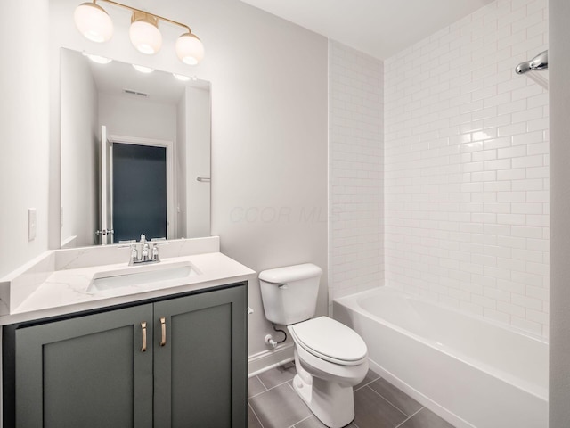 bathroom with toilet, tile patterned flooring, vanity, baseboards, and bathing tub / shower combination