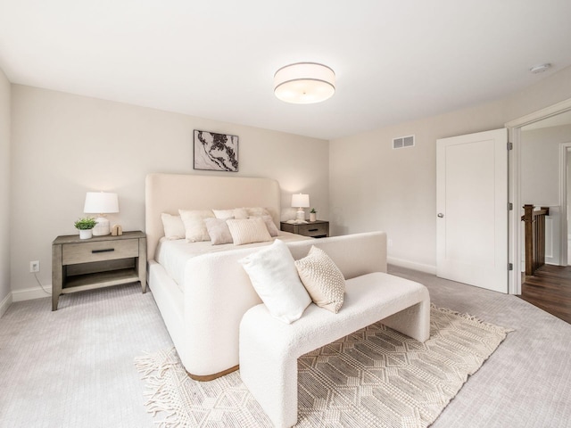 bedroom featuring carpet flooring and baseboards