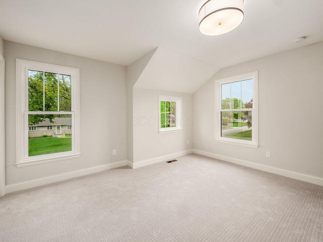 bonus room featuring baseboards, carpet floors, and vaulted ceiling