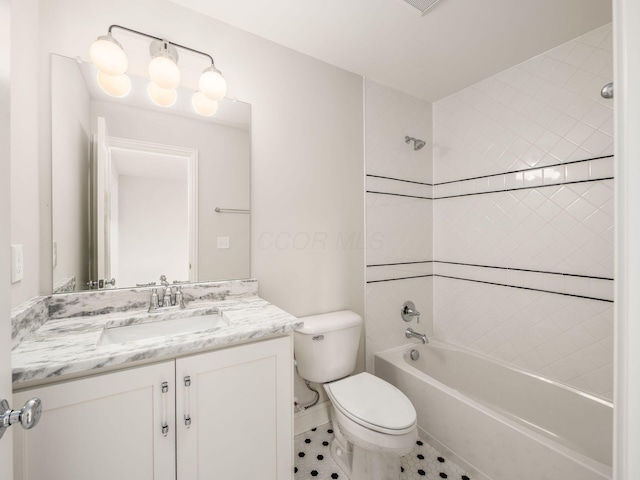 bathroom with vanity, toilet, tub / shower combination, and tile patterned flooring