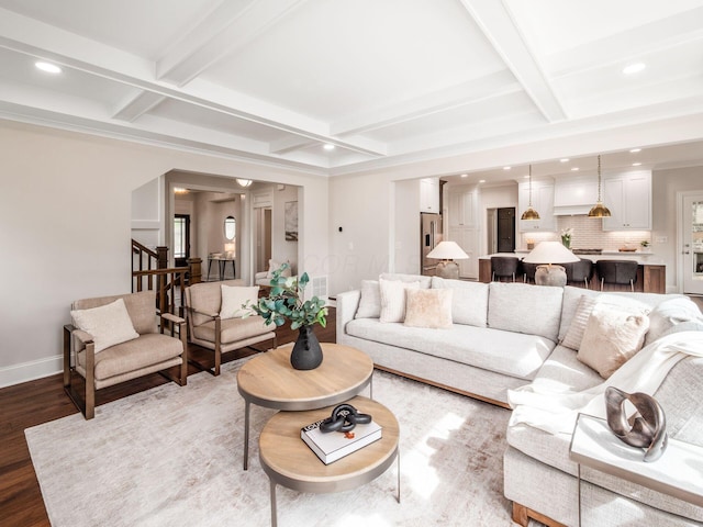 living area with coffered ceiling, wood finished floors, recessed lighting, stairs, and baseboards
