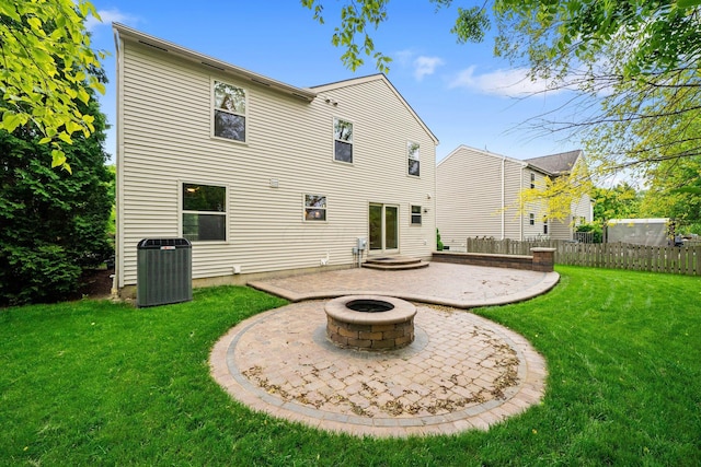 2977 Highwall Way, Columbus, OH 43221 - rear view of house with a fire pit, a patio, and central AC