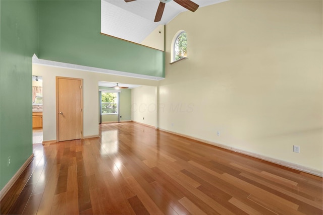 2977 Highwall Way, Columbus, OH 43221 - empty room with ceiling fan, high vaulted ceiling, wood finished floors, and baseboards
