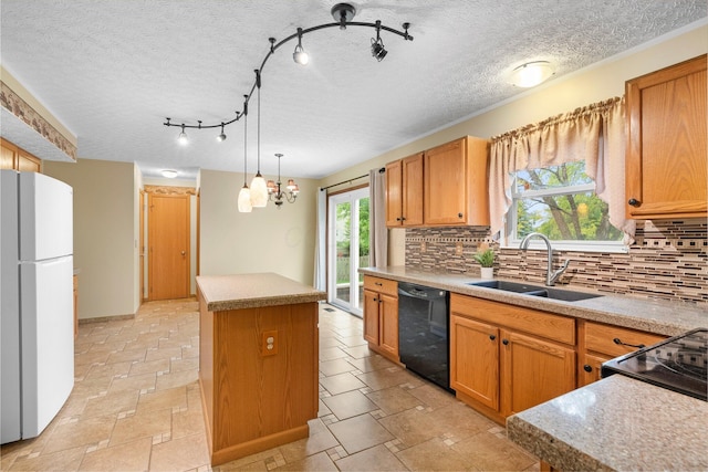 2977 Highwall Way, Columbus, OH 43221 - kitchen with dishwasher, freestanding refrigerator, a sink, a center island, and backsplash