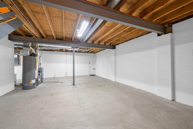 2977 Highwall Way, Columbus, OH 43221 - unfinished below grade area with gas water heater, electric panel, and concrete block wall