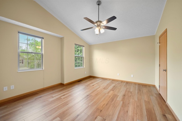2977 Highwall Way, Columbus, OH 43221 - spare room featuring lofted ceiling, light wood-style floors, a ceiling fan, and baseboards