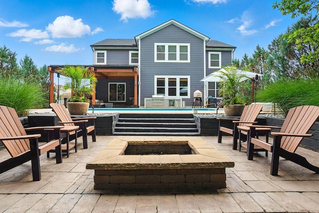 298 Long Branch Run, Delaware, OH 43015 - back of property featuring an outdoor pool, a patio area, and an outdoor living space with a fire pit