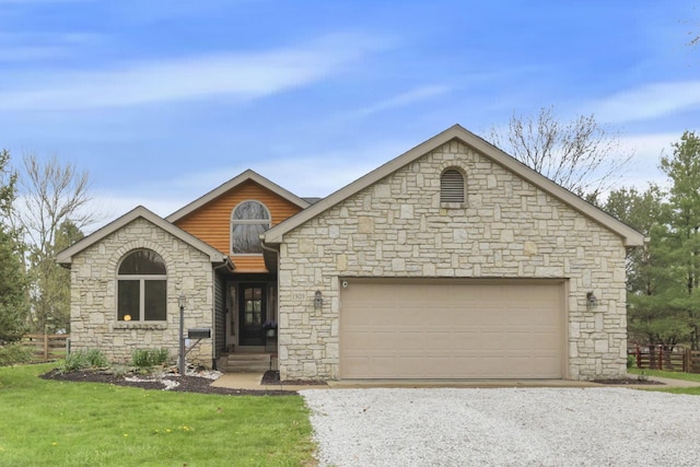 1909 Carroll Eastern Rd NW, Lancaster, OH 43130 - view of front of house with a garage, gravel driveway, a front lawn, and stone siding