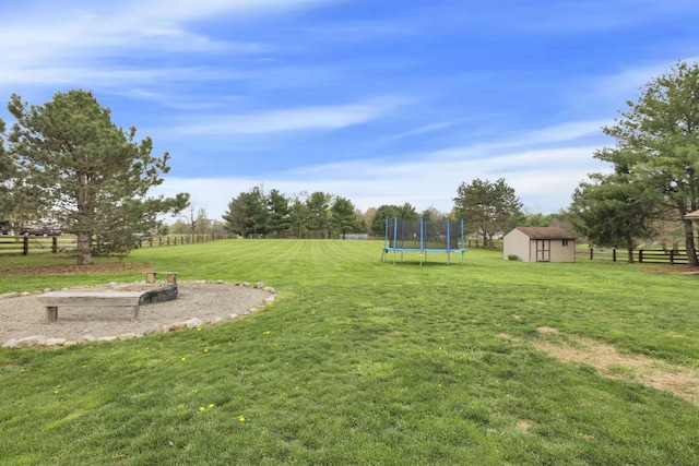 1909 Carroll Eastern Rd NW, Lancaster, OH 43130 - view of yard with a storage shed, fence, an outbuilding, and a trampoline