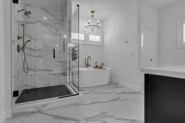 5519 Evans Farm Dr, Lewis Center, OH 43035 - full bath with a freestanding bath, a marble finish shower, marble finish floor, and an inviting chandelier