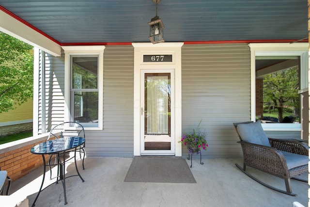 doorway to property featuring covered porch