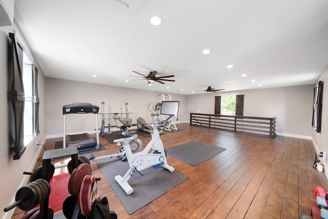 exercise room with recessed lighting, wood-type flooring, ceiling fan, and baseboards