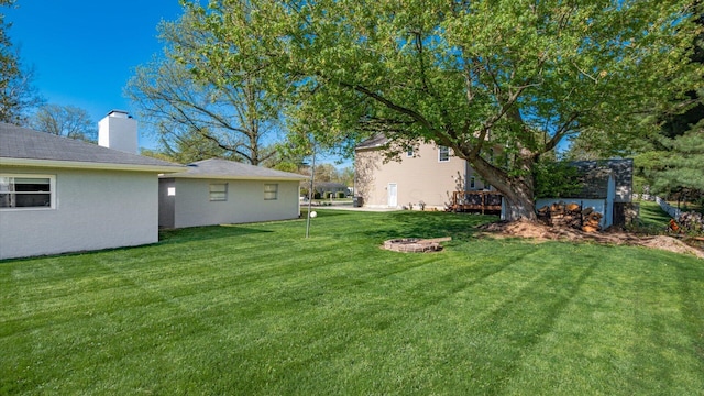 view of yard featuring a deck