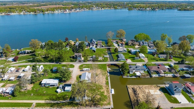 aerial view with a water view and a residential view