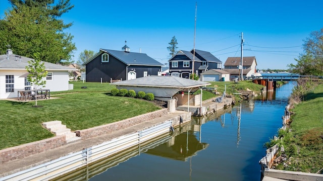 view of dock featuring a residential view, a water view, and a lawn