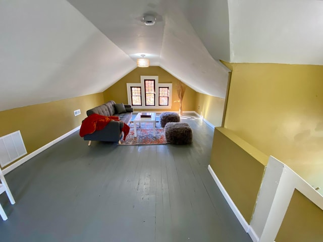 110 N Ogden Ave, Columbus, OH 43204 - additional living space featuring baseboards, visible vents, wood finished floors, and lofted ceiling