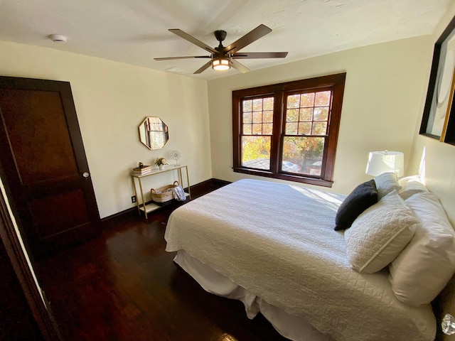 110 N Ogden Ave, Columbus, OH 43204 - bedroom featuring a ceiling fan, dark wood-style floors, and baseboards