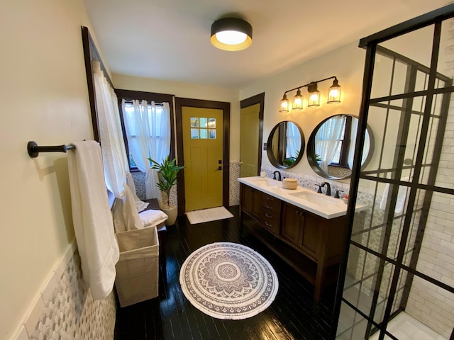 110 N Ogden Ave, Columbus, OH 43204 - bathroom featuring double vanity, hardwood / wood-style flooring, and a sink