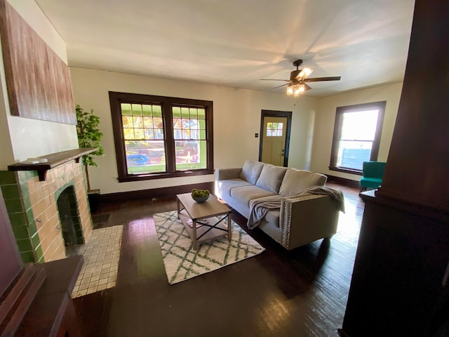 110 N Ogden Ave, Columbus, OH 43204 - living room featuring a fireplace, a ceiling fan, wood finished floors, and baseboards