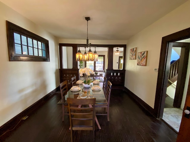 110 N Ogden Ave, Columbus, OH 43204 - dining space featuring baseboards, a notable chandelier, and wood-type flooring