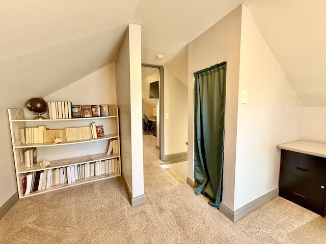 bonus room with lofted ceiling, carpet flooring, and baseboards