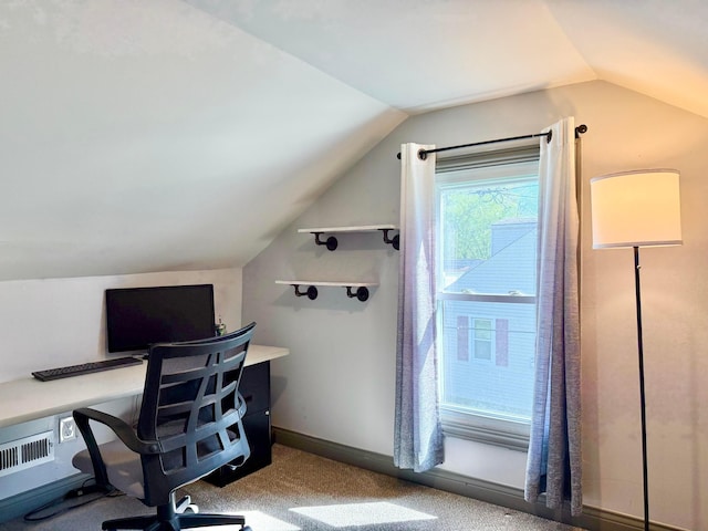home office with visible vents, lofted ceiling, and carpet floors