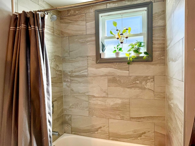 bathroom featuring shower / bathtub combination with curtain