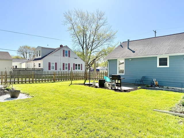 view of yard featuring a patio and fence