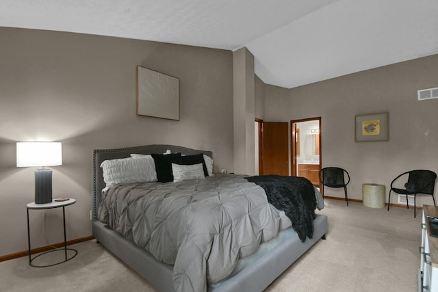 carpeted bedroom featuring baseboards, connected bathroom, vaulted ceiling, and visible vents