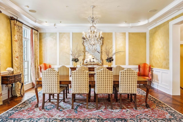 dining space with an inviting chandelier, ornamental molding, and wallpapered walls