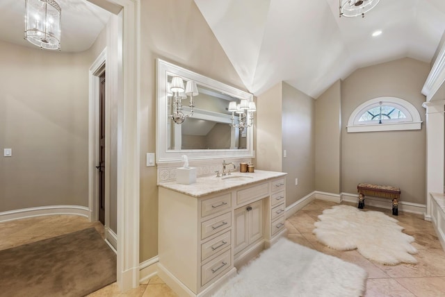 bathroom featuring a notable chandelier, vanity, tile patterned floors, lofted ceiling, and recessed lighting