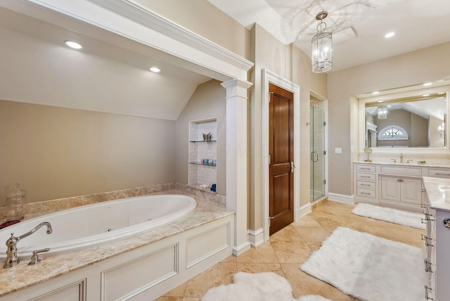 bathroom featuring vanity, a whirlpool tub, a shower stall, and lofted ceiling