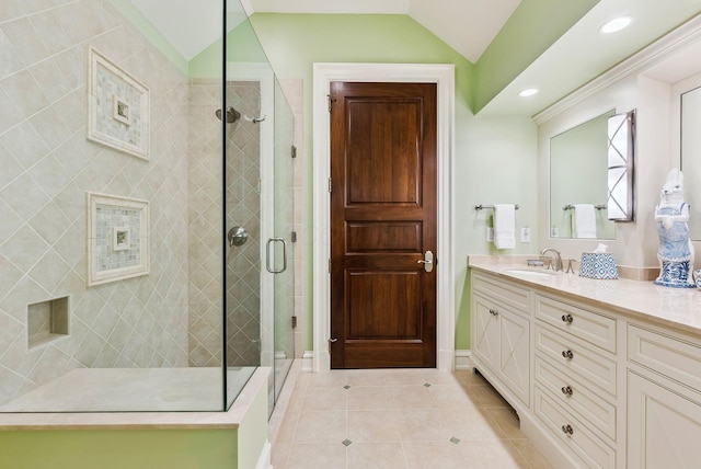 bathroom with tile patterned flooring, vanity, lofted ceiling, recessed lighting, and a stall shower