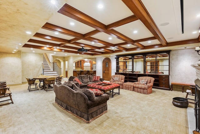 carpeted living room featuring arched walkways, beam ceiling, stairway, coffered ceiling, and recessed lighting