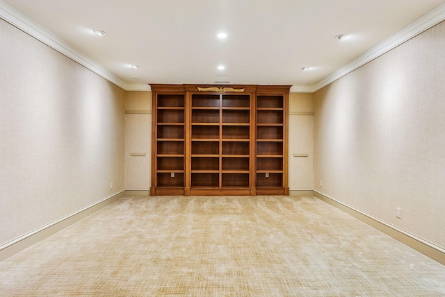 basement with crown molding, baseboards, and carpet
