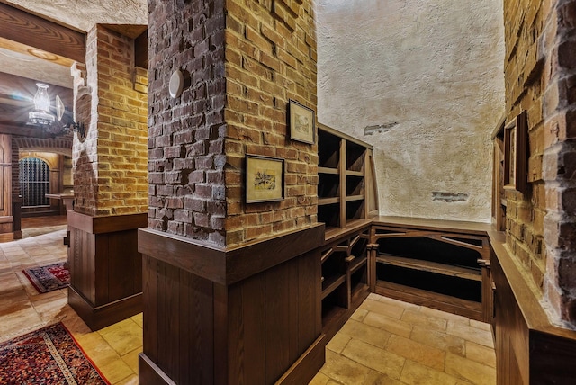 wine cellar with stone tile floors