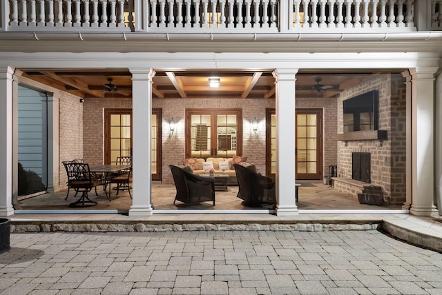 view of patio / terrace featuring a ceiling fan, an outdoor living space, and a balcony