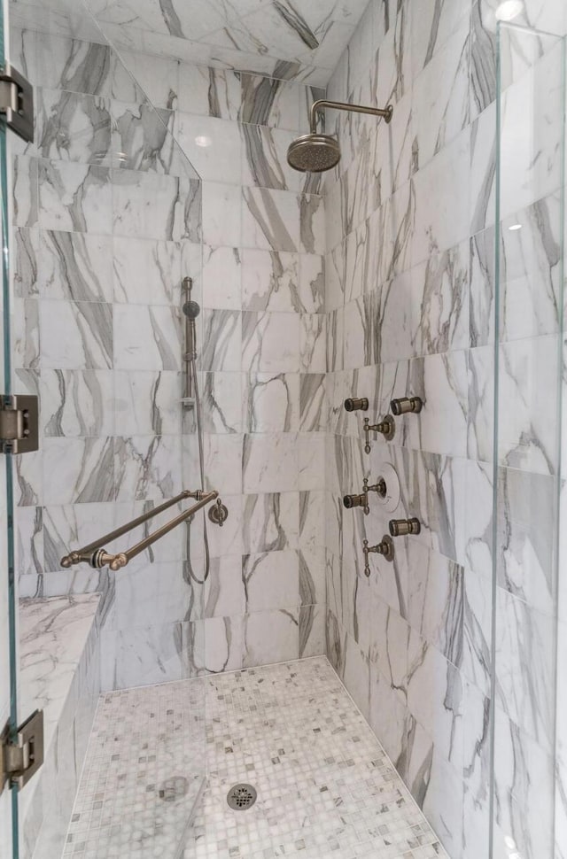 bathroom featuring a shower stall